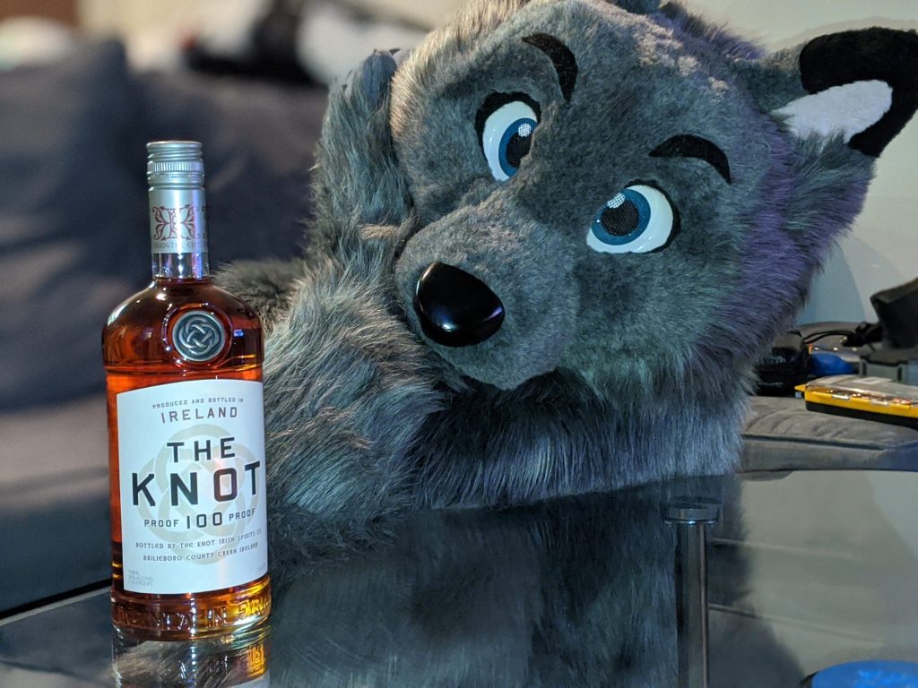 Cute wolf looking at The Knot Whiskey