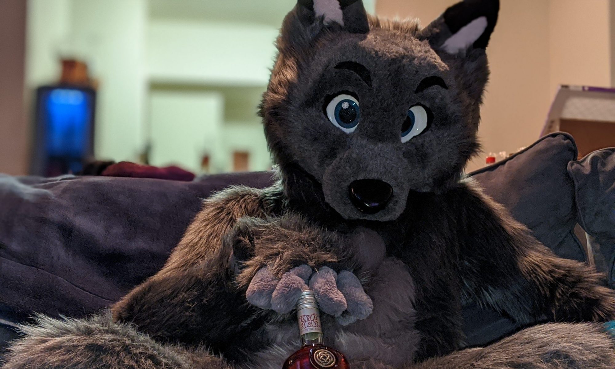 Seductive wolf eyes holding a bottle of "The Knot" between their legs. Partially cut off